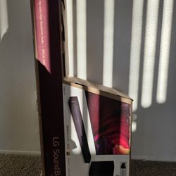 LG SN5Y sound bar and speaker