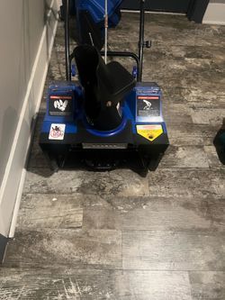 Battery operated snow blower