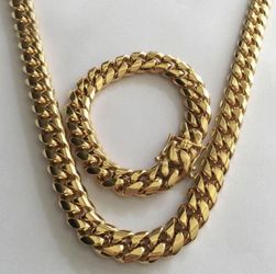 New 18 k yellow gold Cuban link chain and bracelet