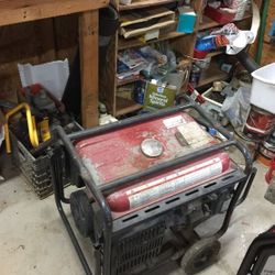 5 KW Kawasaki Generator. Electric start. Dent in gas tank. On wheels.