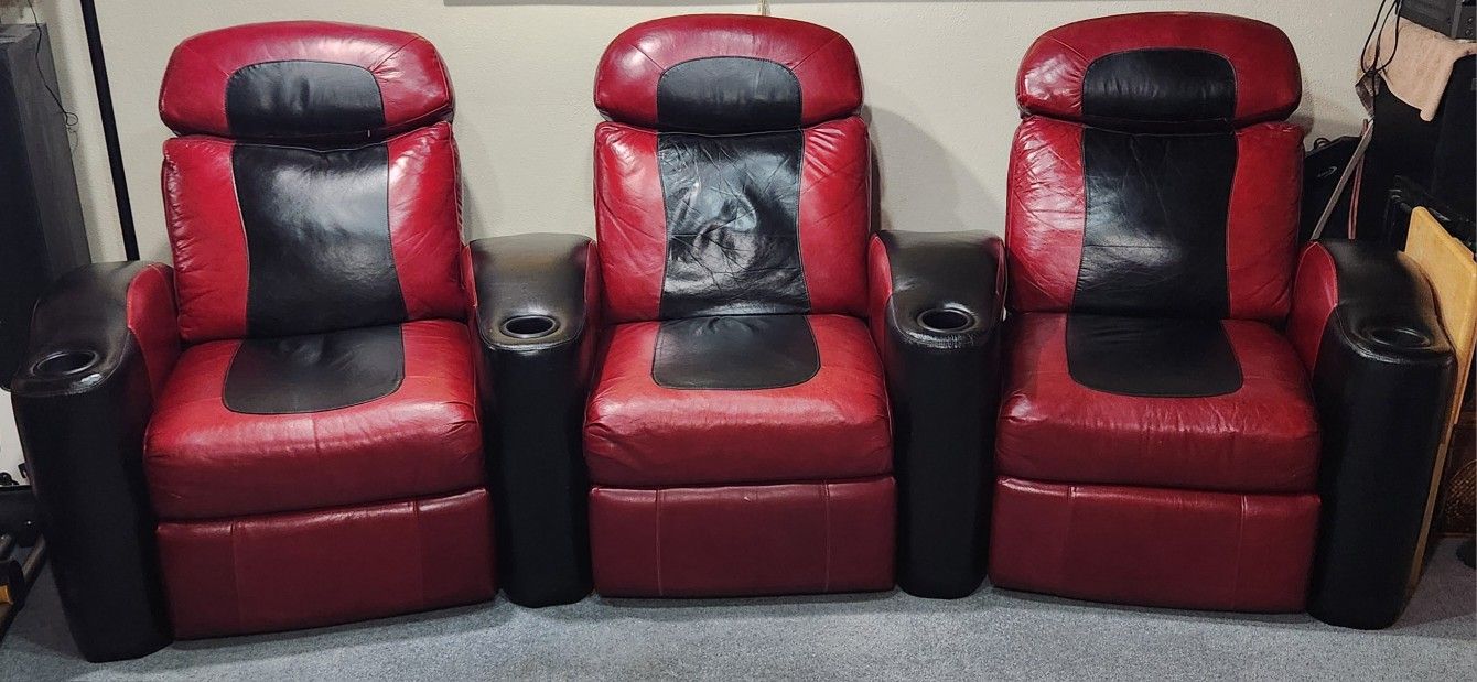 Set of 3 leather reclining theatre chairs with "buttkicker" subwoofer systems installed.