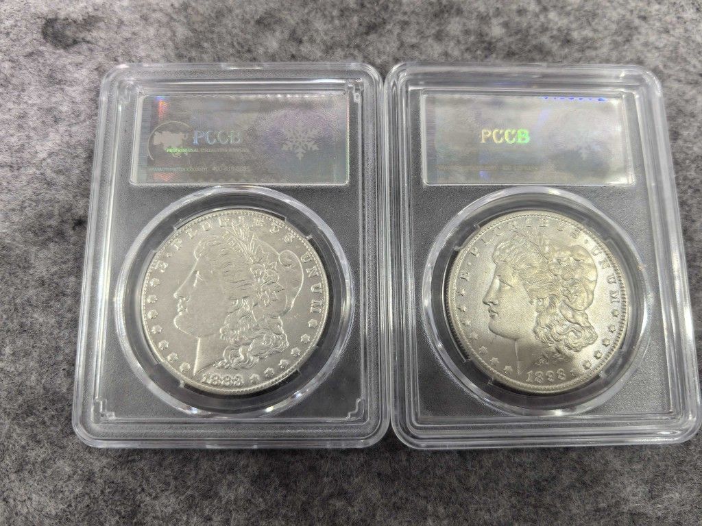 2 Morgan silver dollars (1883CC. 1893CC)