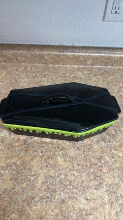Rae Dunn "Slime Drip" coffin-shaped baking dish with a matching lid.