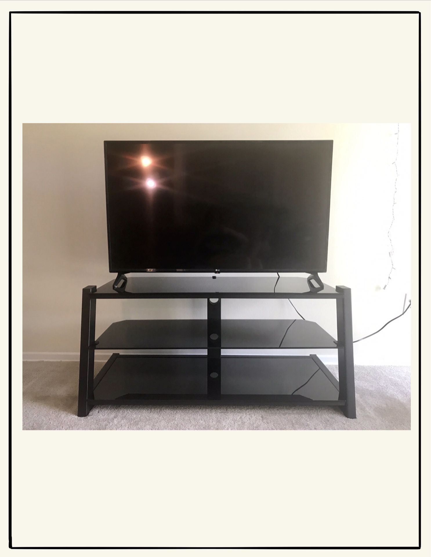 Black glass/metal TV stand (50 inches)