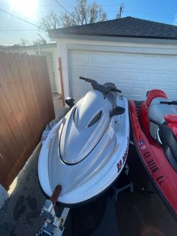 2 jet skis and a trailer