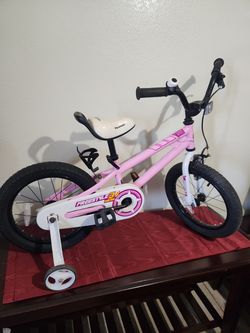 Girl pink bike w / helmet