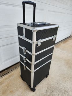 Aluminum rolling cosmetic makeup train case.