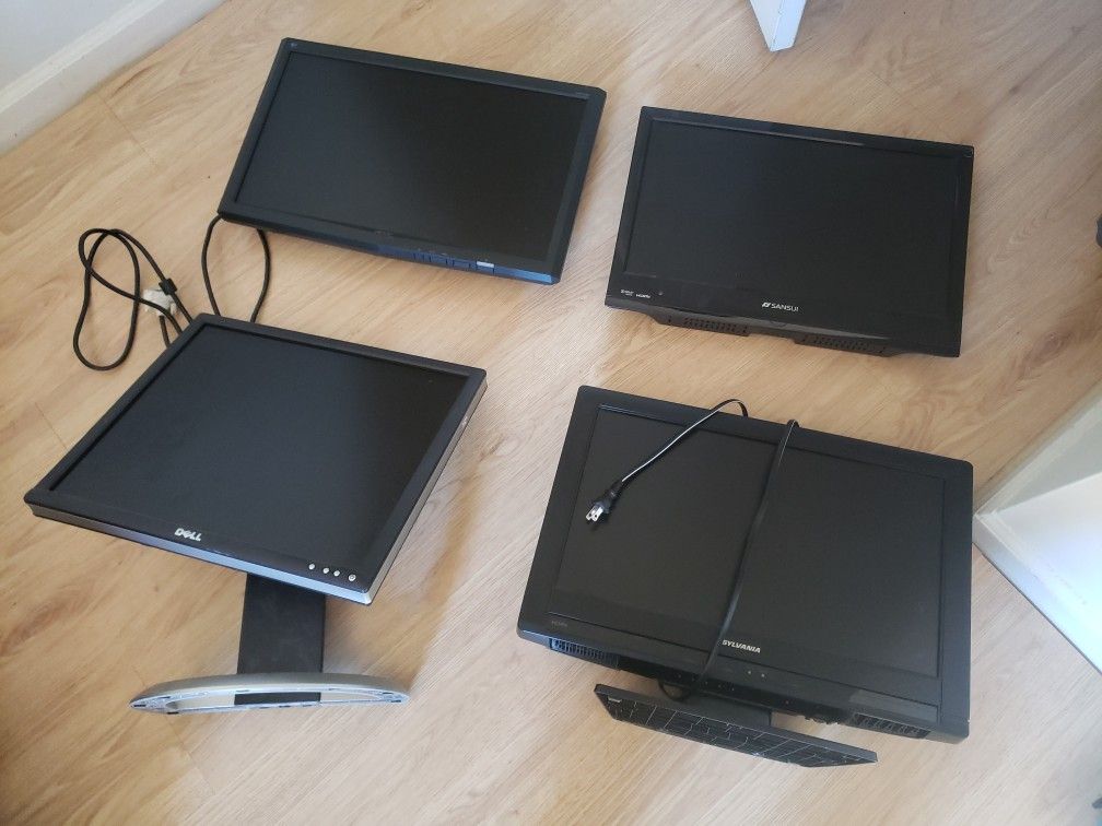 four flat screen monitors including 2 TVs