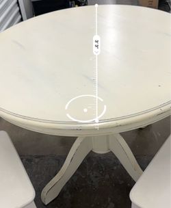 Round dining table and two chairs