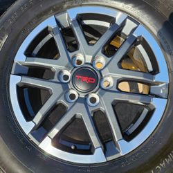 Set of (4) new 18" 2025 TRD Sport wheels with original Michelin 265 65 18 tires