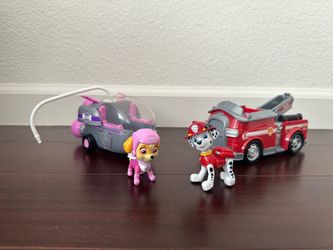 Paw Patrol Marshall and Skye figurines and vehicles