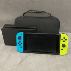 Nintendo switch unit with power cord, dock, and soft case