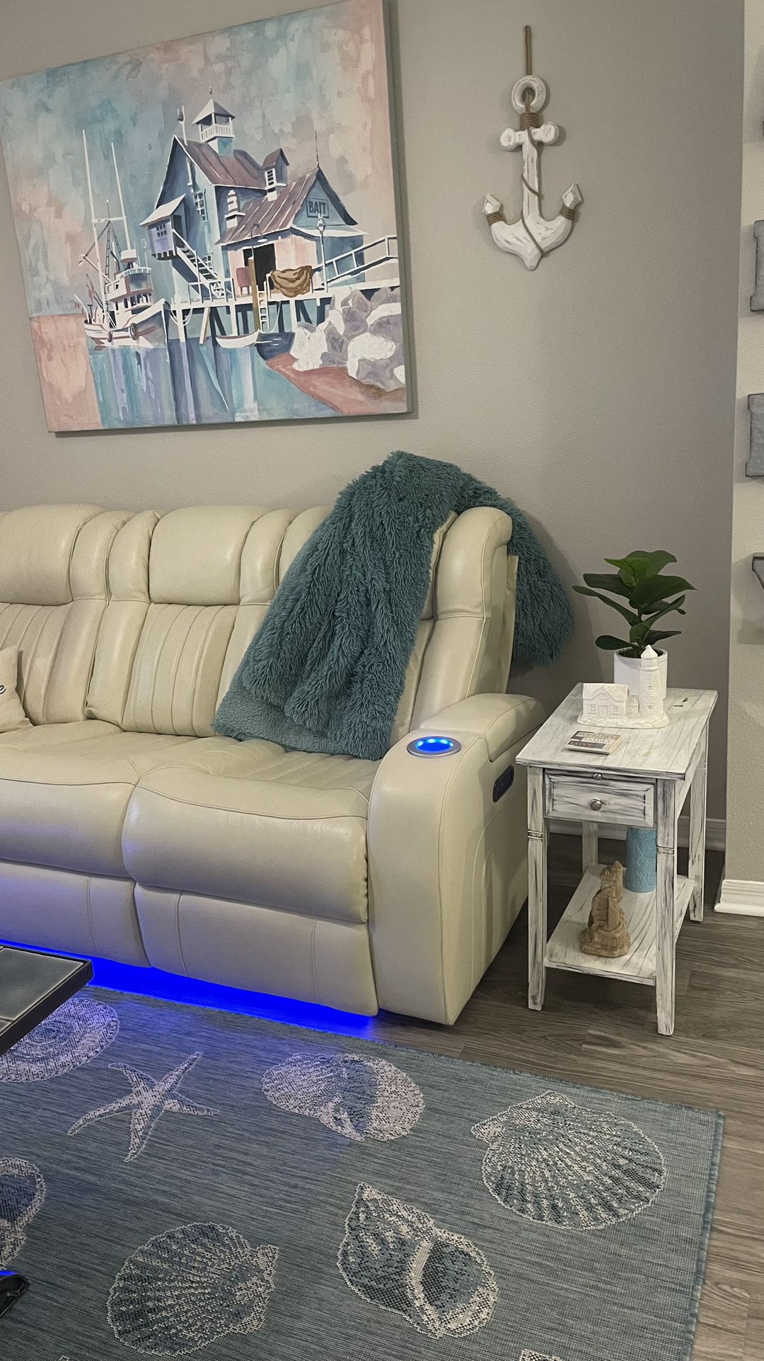 Ivory, White Real Leather Couch, And Loveseat With Electric Recliners, Dual On Both The Couch And Loveseat With Phone, Chargers, And in light lighting