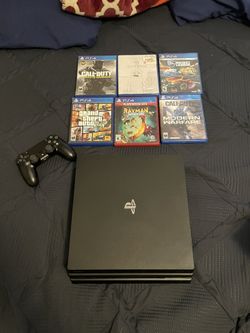 PS4 w/ controller and 6 games