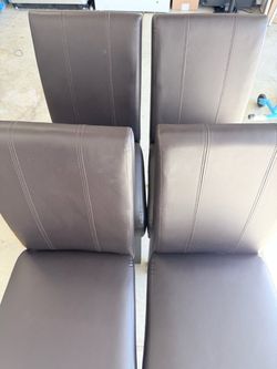 Set of four brown dining chairs