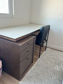 Desk with wooden drawer and glass top