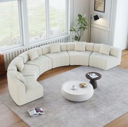 Brand new in packaging boneless cream colored couch