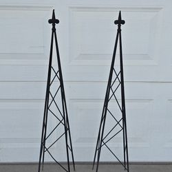 Pair of black wrought iron garden obelisks