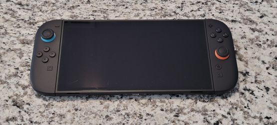 Nintendo Switch 2 With Controller, Case, and two Games