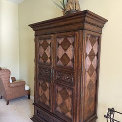 Beautiful Tommy Bahama hutch  featuring a distressed cherry finish & detailed diamond-carved panels - 49” x 22” x 86” - Retail: $4500