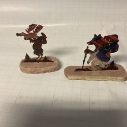 Metal Figures On Rock