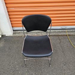 Black Stackable Chair with Reclining Back