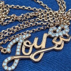  14K Rose Gold JOY Script Pendant suspended from a dainty 14K Rose Gold Necklace With 33 meleé diamonds 