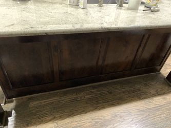 Kitchen Island with dark stain approximately 7.5 feet by 3.5 feet.