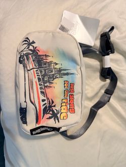 Disney’s white crossbody features the Retro Monorail