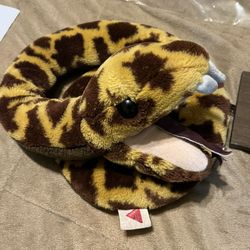 Vintage Dakin Rattlesnake Plush Toy with Rattle Tail – Stuffed Snake  ⸻  Description  Vintage plush rattlesnake toy with yellow and brown patterned fa