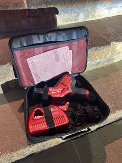 Milwaukee M12 HACKZALL Reciprocating Saw with battery, bag and charger.