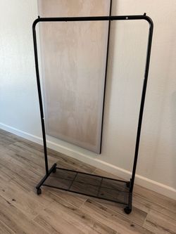 Rolling clothing rack $30 obo