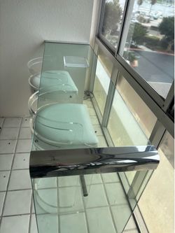 Glass and Chrome Dining Table with Chairs
