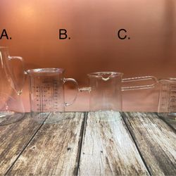 Assorted types of glass measuring cups or beakers  (Priced Individually). See Description.  A. $15.  B. $19. C. $25. D. $12.