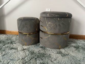 Set of two gray and gold ottomans