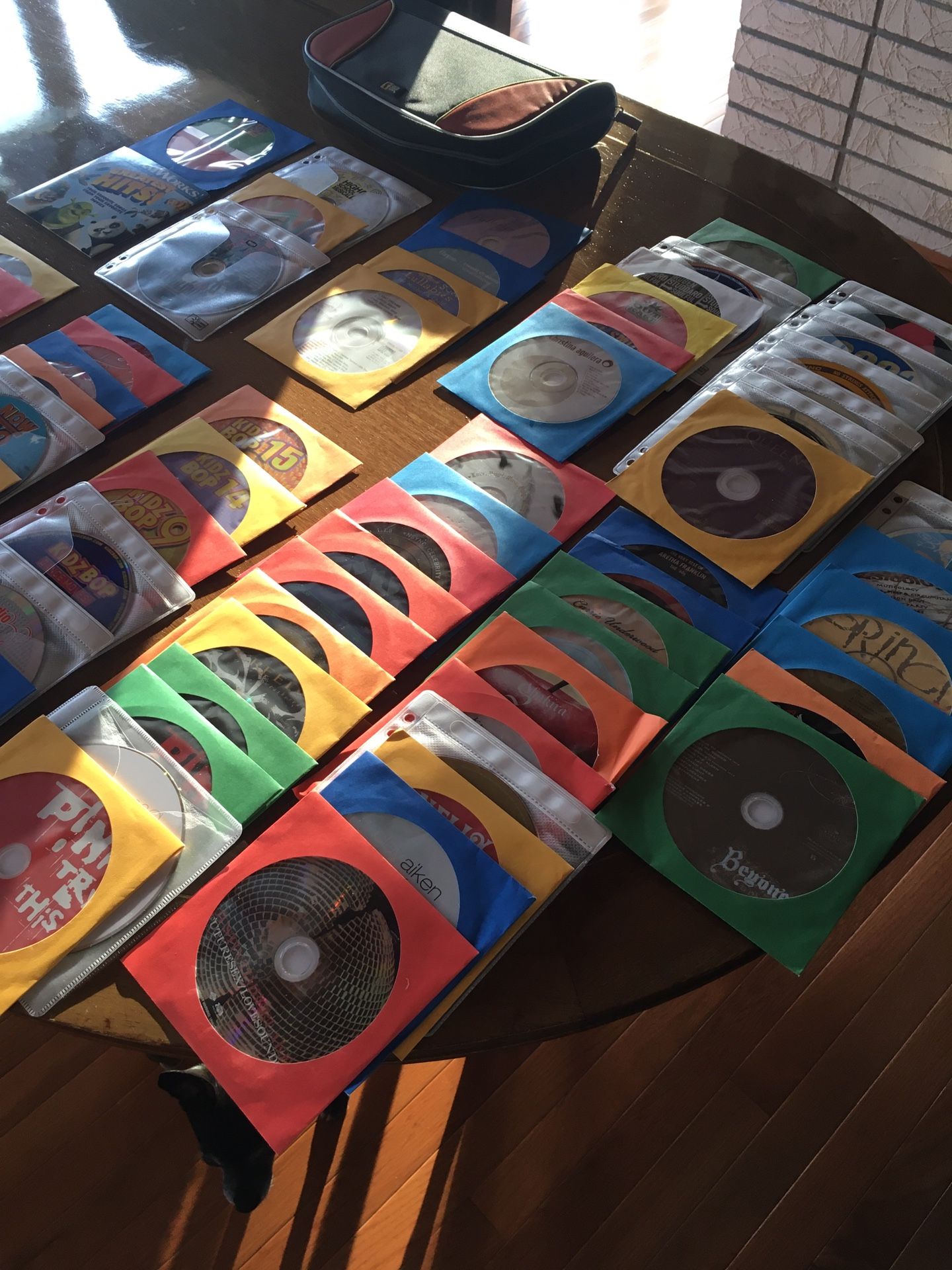 ASSORTMENT OF 67 MUSICAL CD’S WITH A CARRYING CASE FOR YOUR FAVORITES...