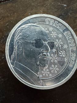 1/2 oz silver round  2026 Coach Snoop Winter Games Silver Round featuring a profile of Snoop Dogg.