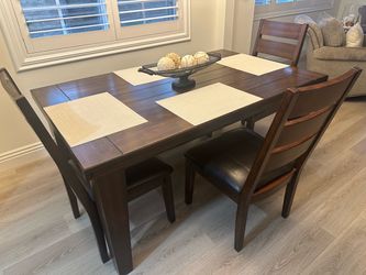 Ashley’s furniture, dining table 3 chairs, one bench