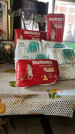 4 Huggies Little Snugglers Size 4 Mama Bear Size 5 Diapers 