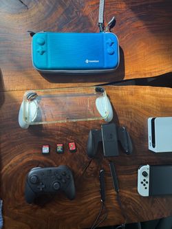 Switch OLED 4-game & Pro Controller Bundle – Excellent Condition