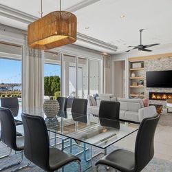 Glass dining table from Scan Design with 8 gray chairs and rug included