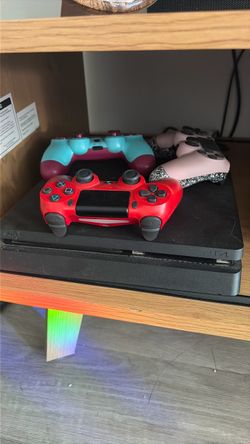 Sony PS4 Slim Console with 3 Controllers