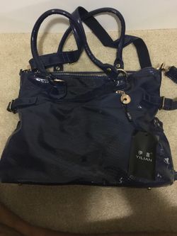 Blue purse with tags