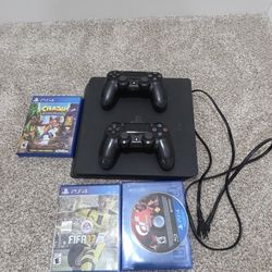 PS4 Slim (Great Condition) With 2 Controllers And Games