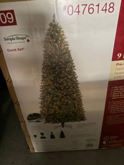 Holiday Living 9-ft pre-lit Robinson Fir Christmas tree Price: $125