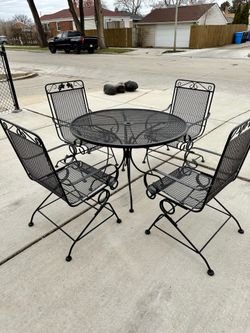 Wrought Iron Patio Set,, Table With 4 Bouncy Chairs, Great Cond. Local Delivery Available For Extra Cost
