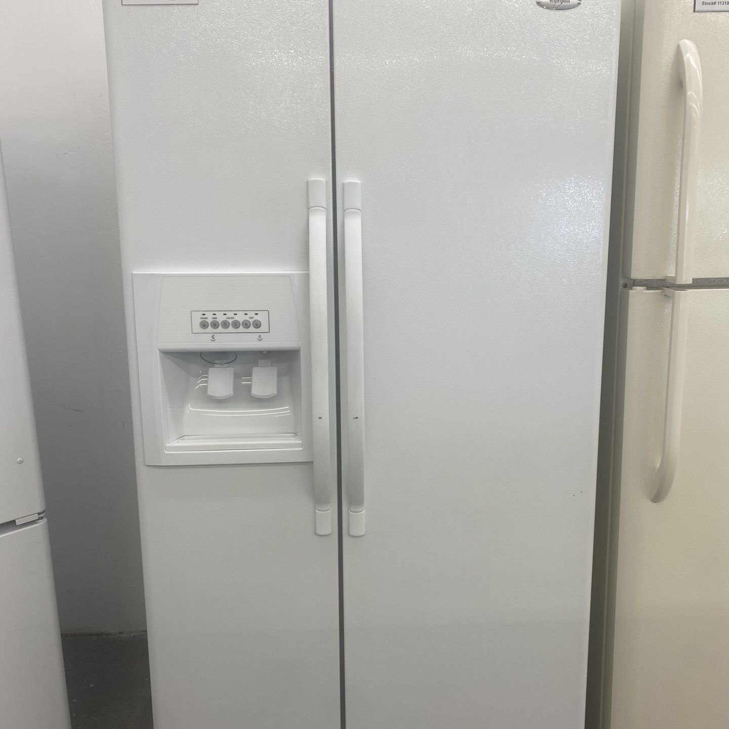 White Whirlpool Side by Side Refrigerator and Freezer