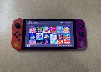 NINTENDO SWITCH OLED MOD + 100 SWITCH GAMES and 7500 RETRO GAMES INCLUDED