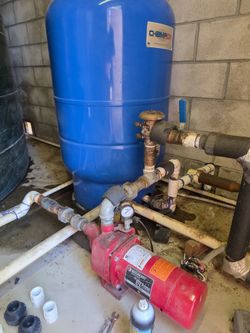 Booster pump and pressure air tank