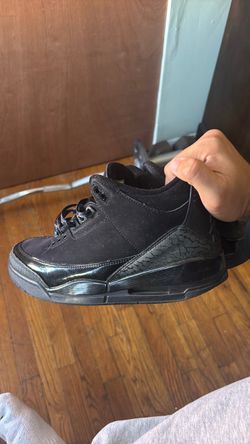 Very beat up black cat 3s